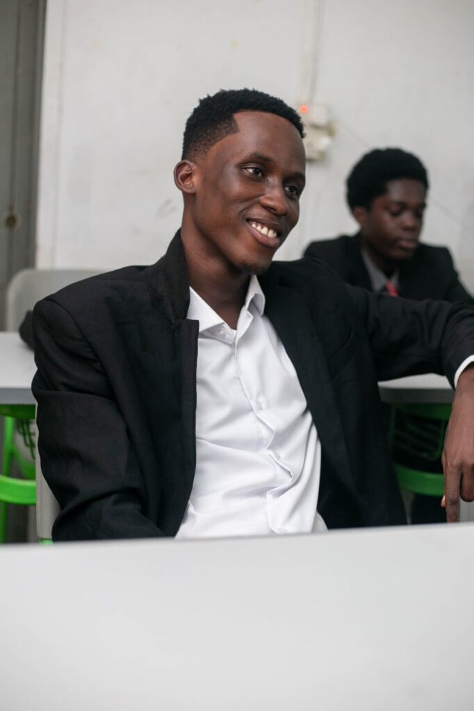 Man in suit sitting at table