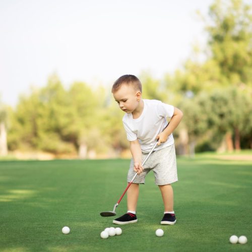 Gallery little-boy-playing-golf-with-golf-club-on-green-fi-2023-11-27-05-34-35-utc.jpg